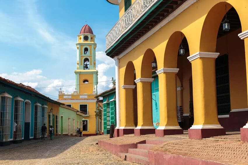 Cobbled street and colorful colonial houses in Trinidad